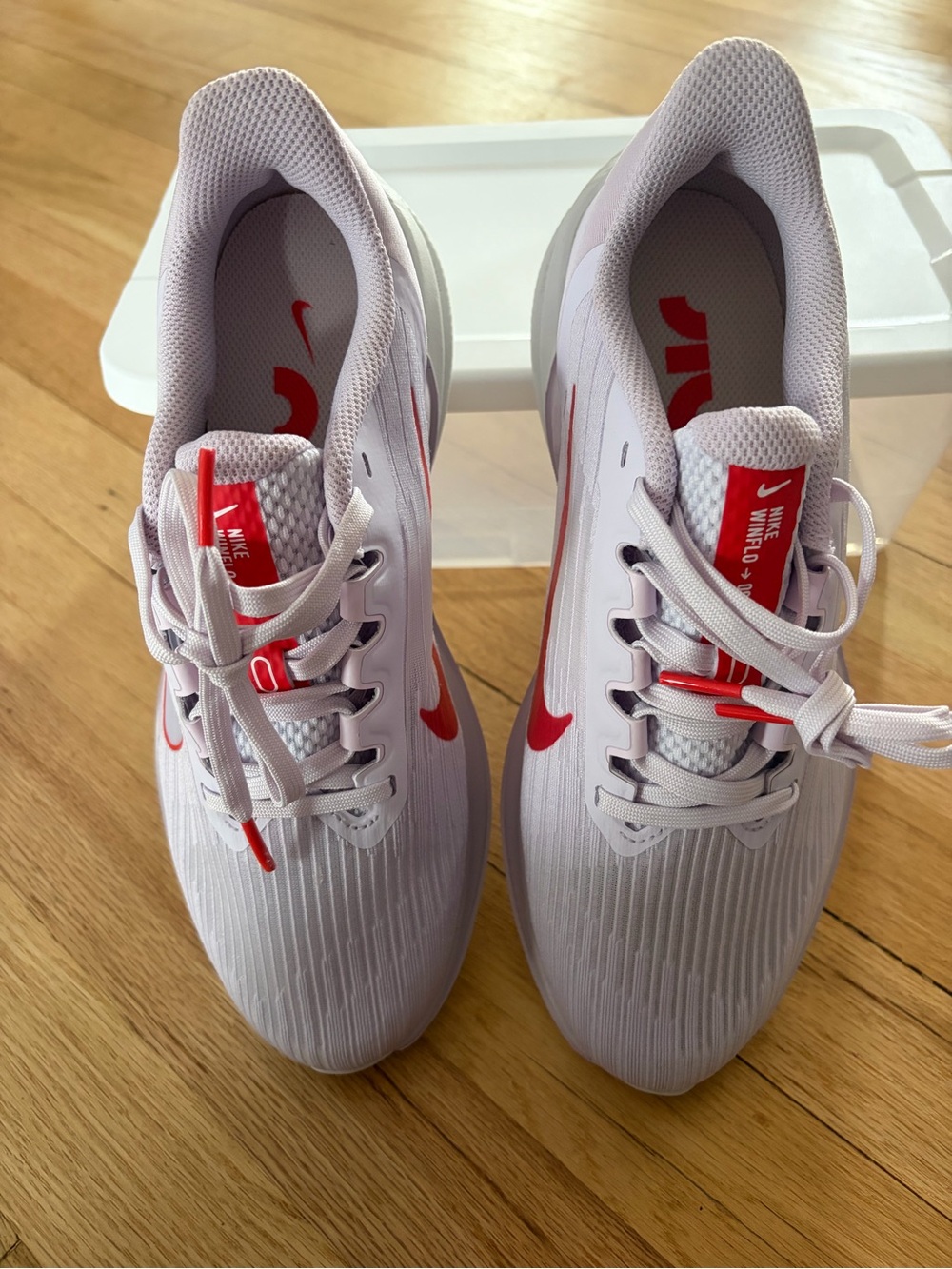 Nike White/Light Purple Trainers with Red Swoosh Accents